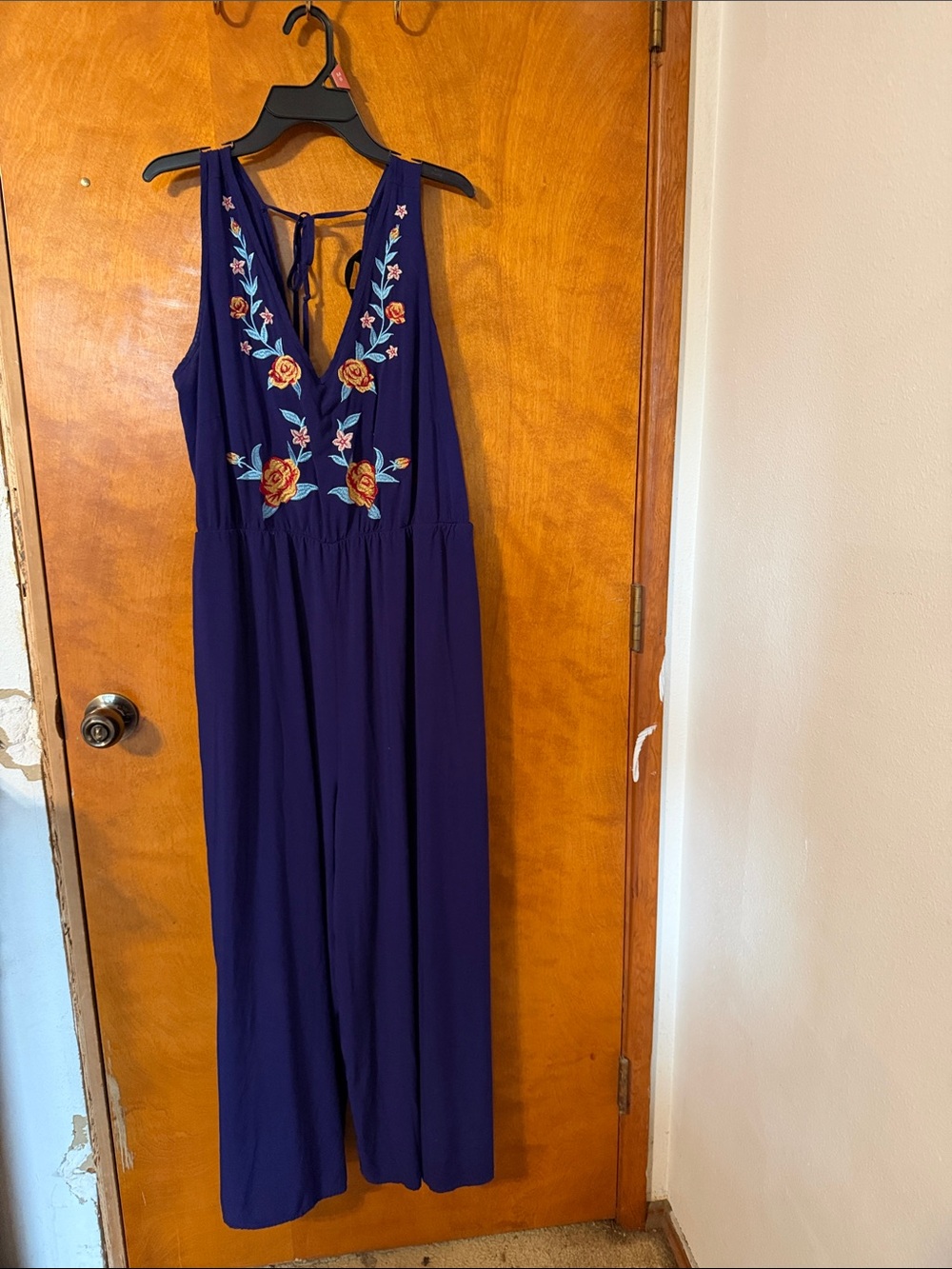 BloomChic Navy Blue Embroidered V‑Neck Jumpsuit